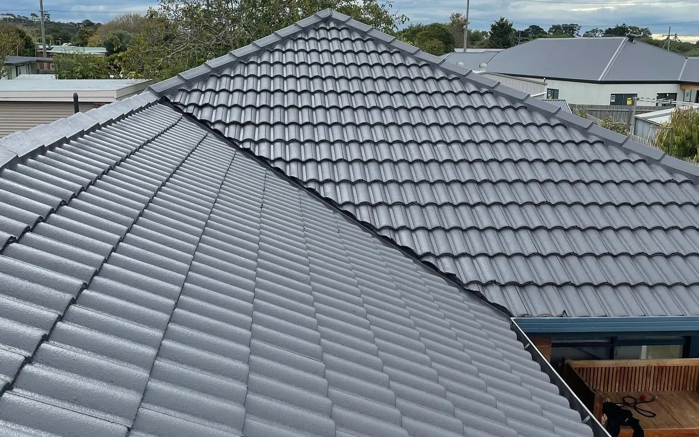 Hip roof after restoration in a gloss charcoal grey membrane