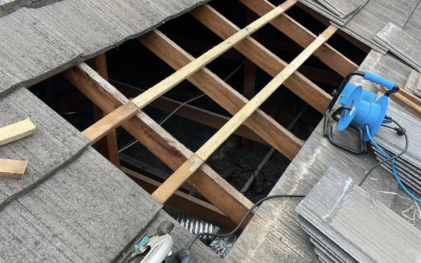 Tiles lifted and new battens fitted during a roof repair