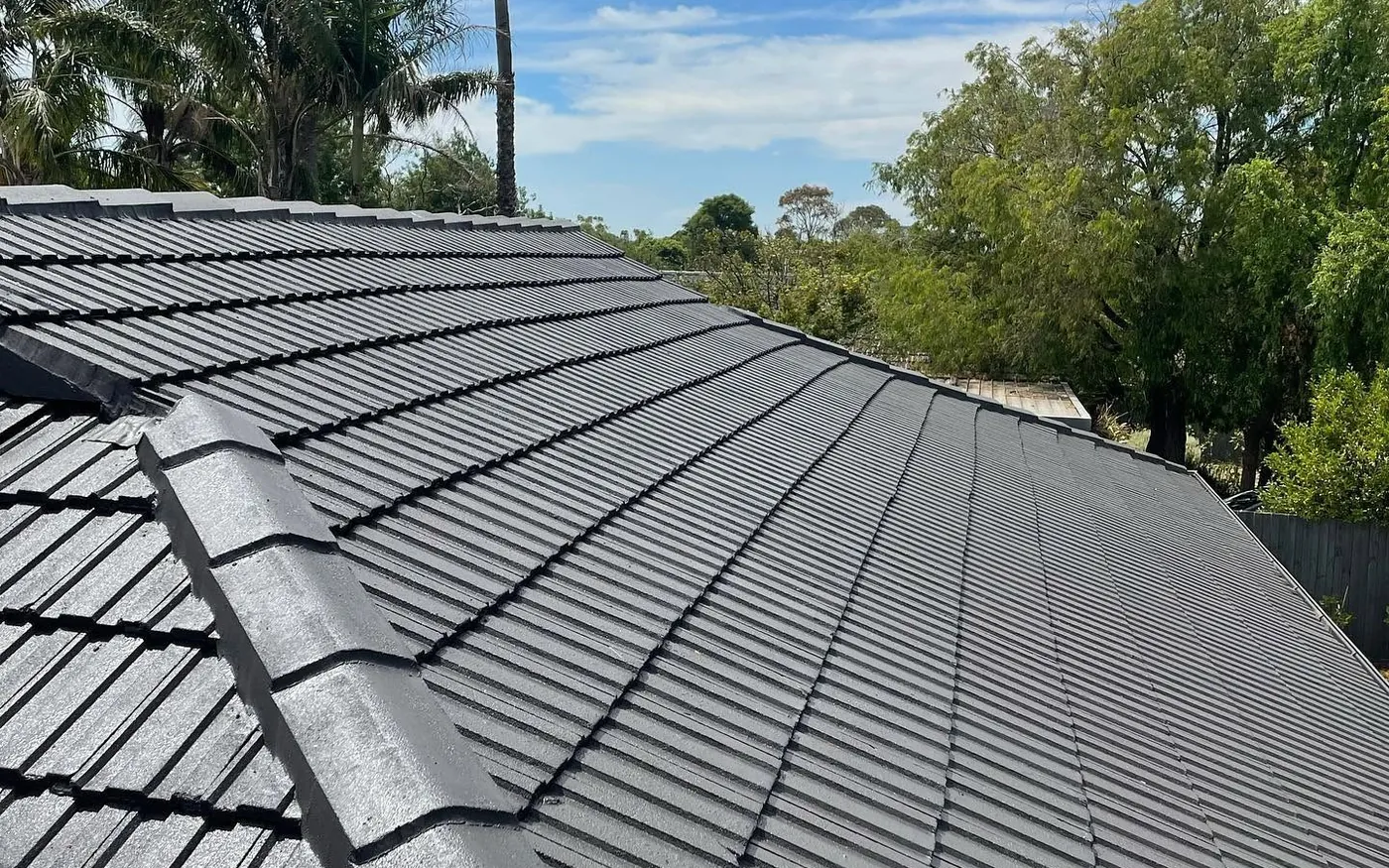Completed roof restoration in a Monument-style grey membrane coating